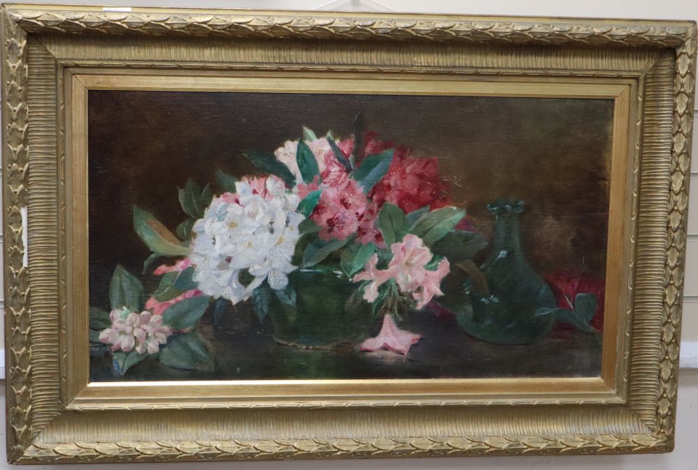 English School, oil on board, Still life of spring flowers on a table top, 44 x 80cm